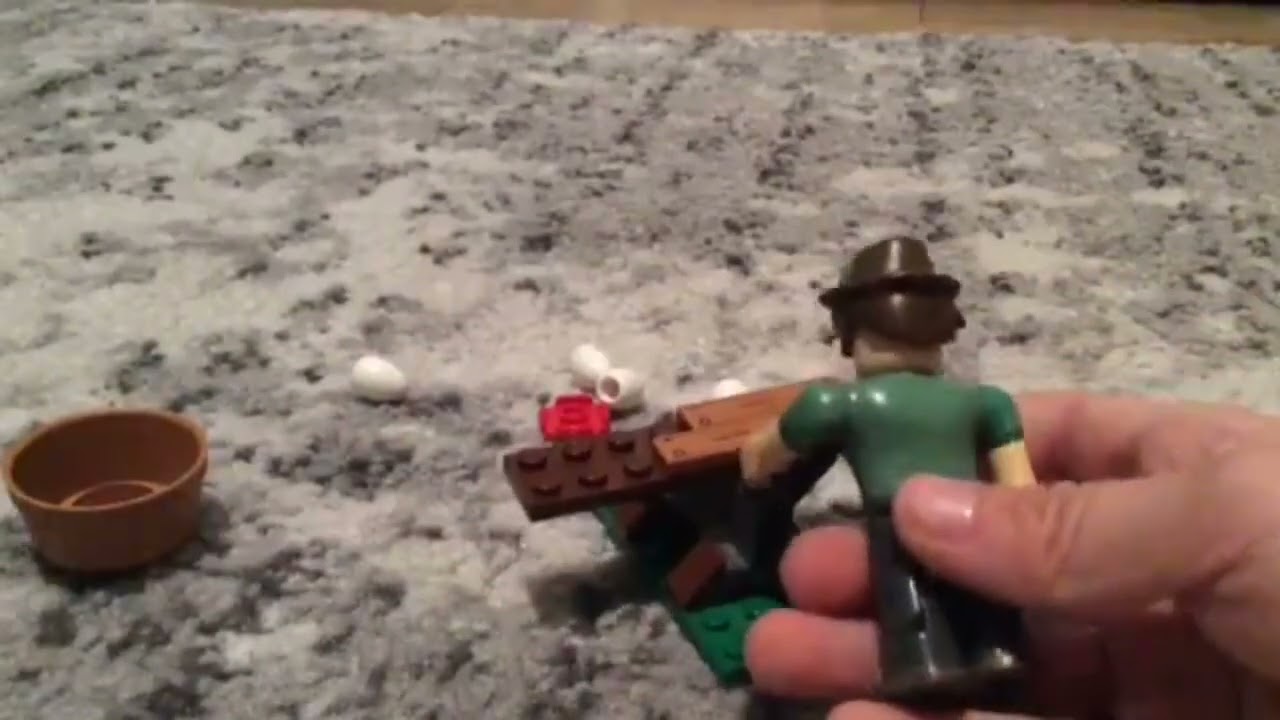 Camper boy plays with legos…