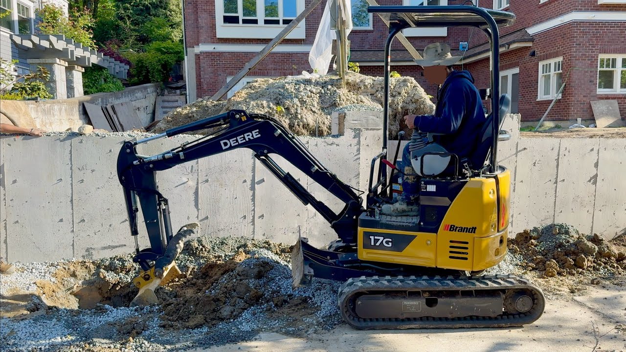 Mini Excavator Digging a New Electrical Line