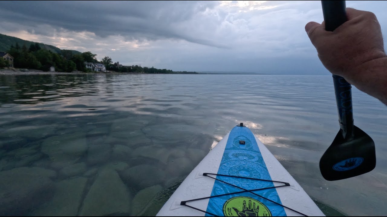 Relaxing Paddle Boarding on the Georgian Bay, with my dog and rain.