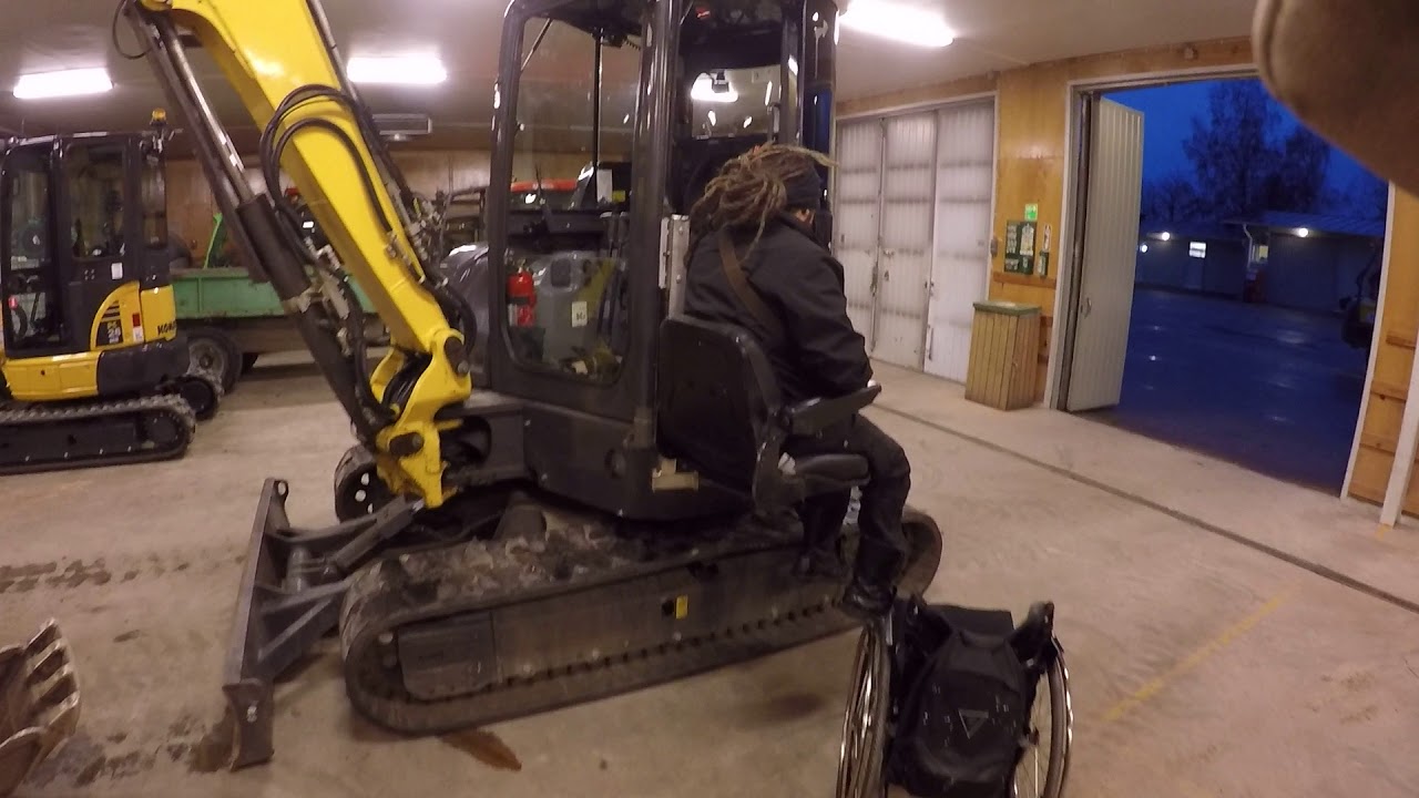 getting into the excavator from wheelchair