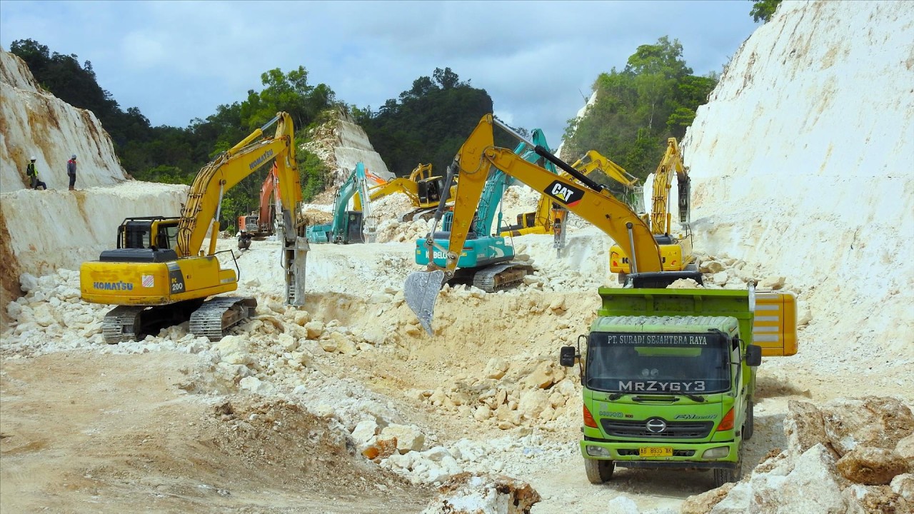 Tearing Through Giants: Excavator Carves Road into Limestone Hill
