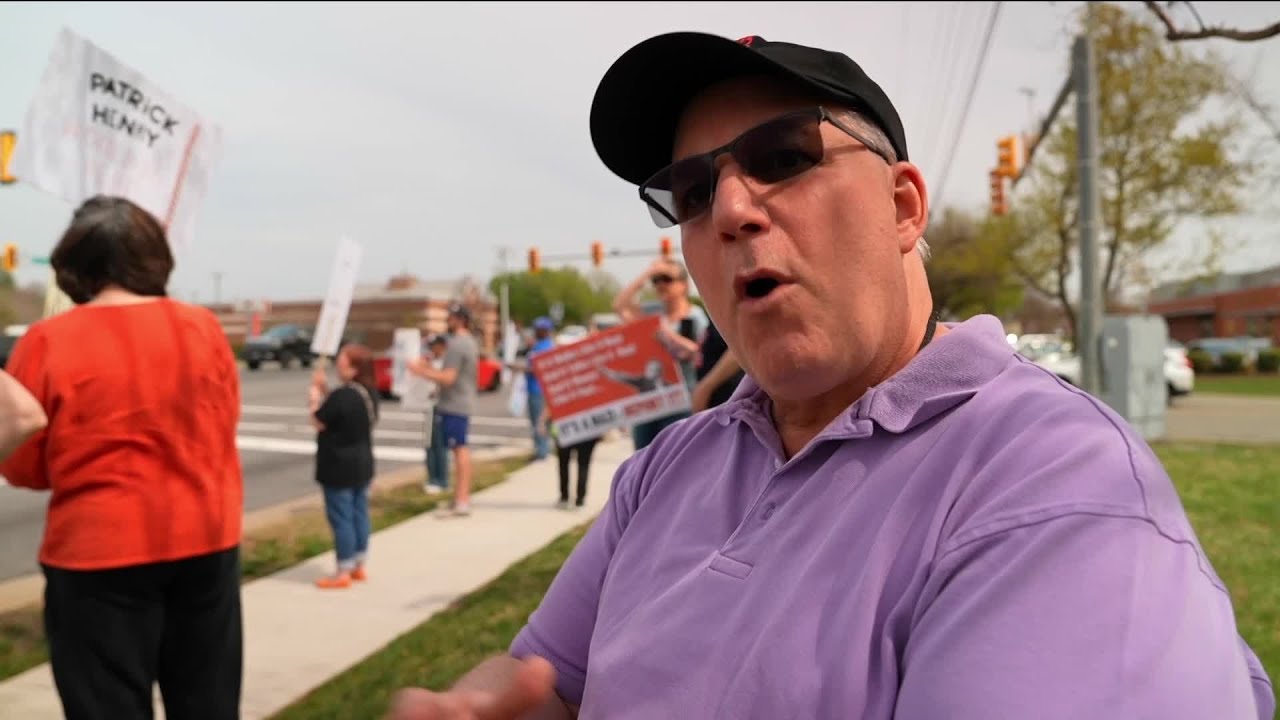 Crowd protests outside Tesla dealership in Henrico's West End