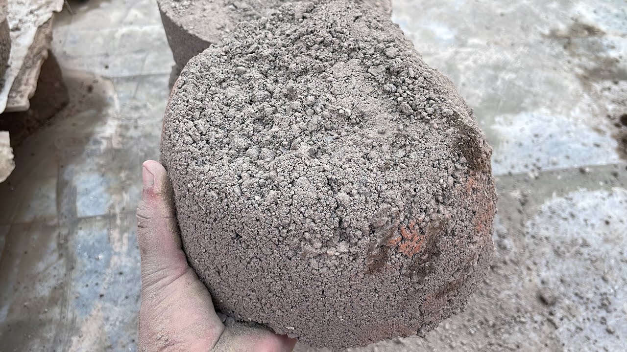 Gritty Charcoal Sand Crumbling in Water