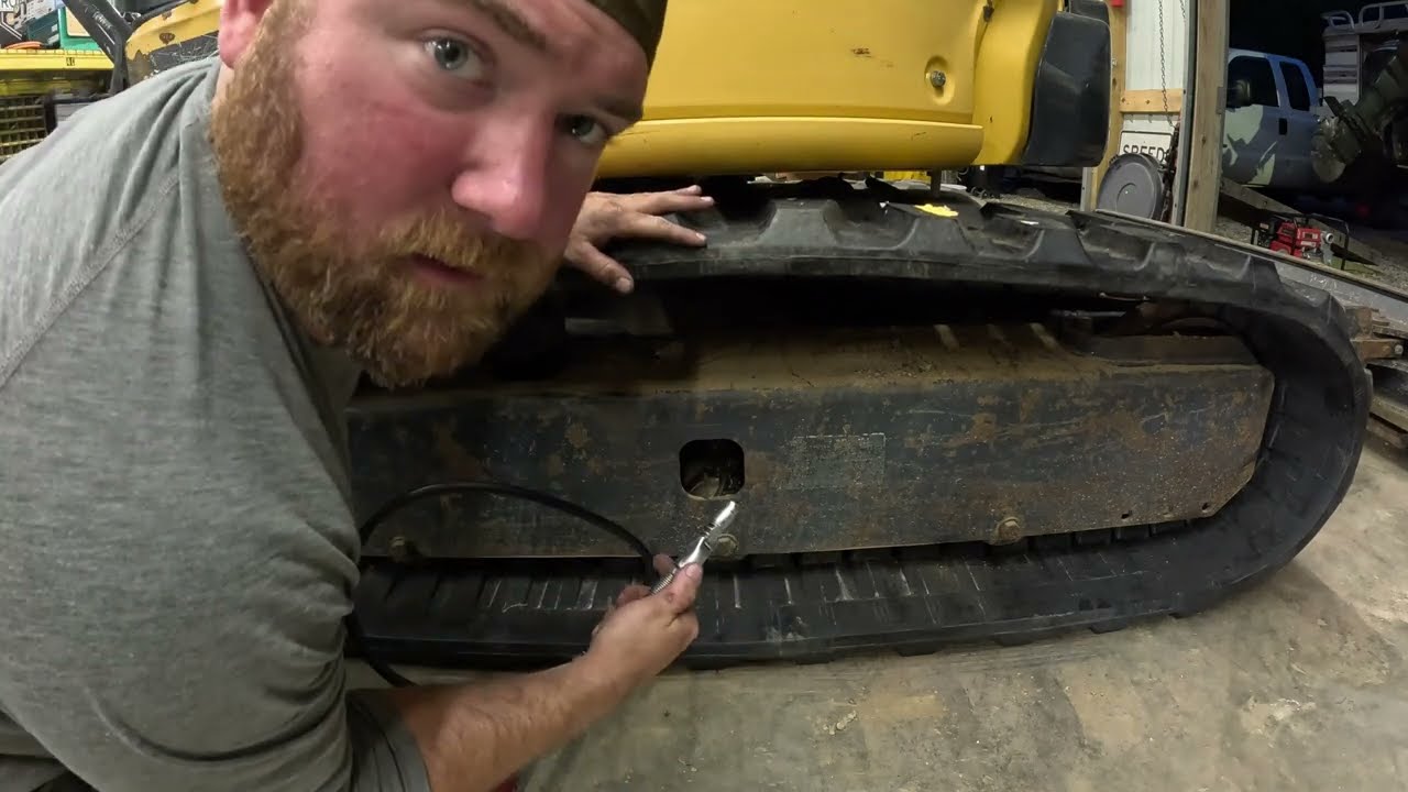 Replacing tracks on a Deere 50g