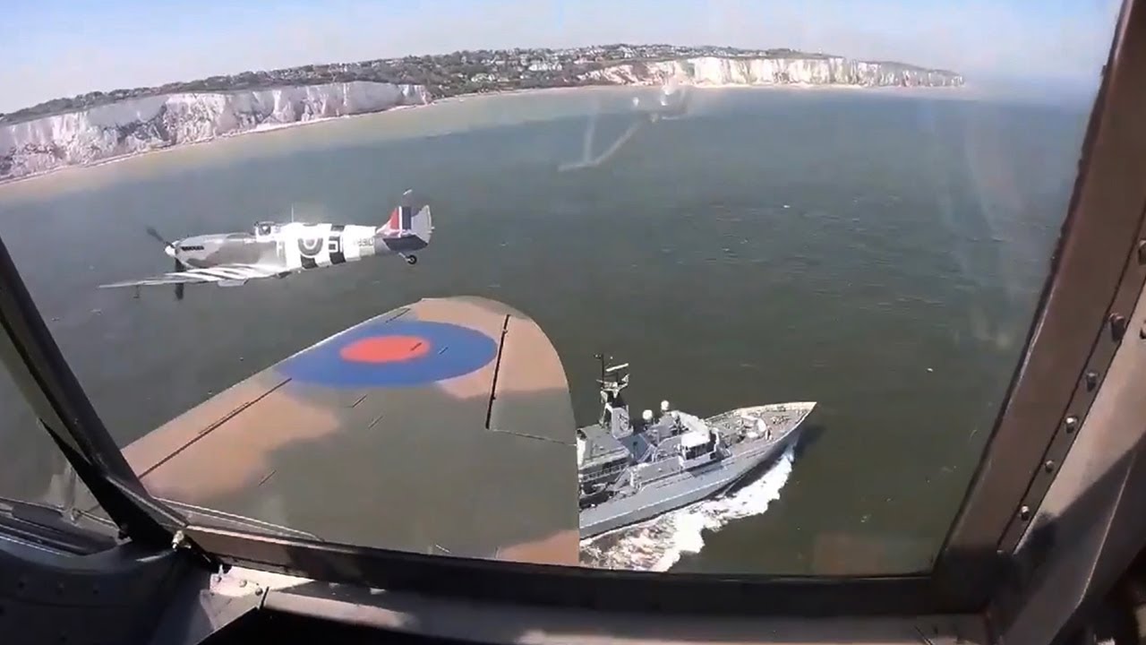 Spitfire flypast over HMS Severn off the white cliffs of Dover