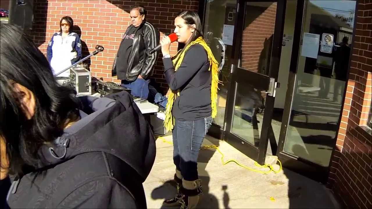 Holly Sock sings while Chief Aaron Sock raises Elsipogtog flag on Elsipogtog Day