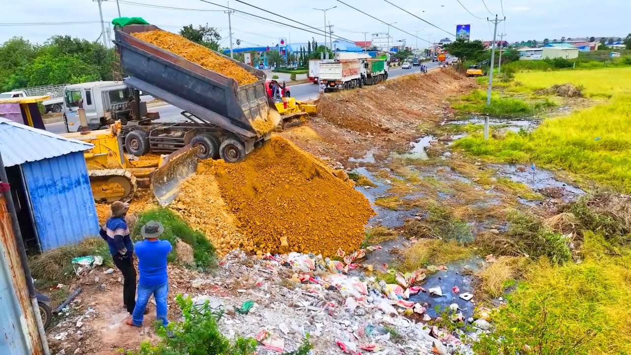 Heavy machinery, Processing Filling Up Land huge, Bulldozer KOMATSU, Dump Truck unloading