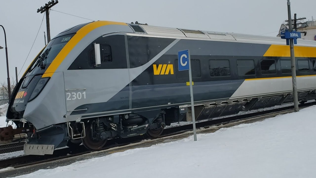 WINTER TRAINS Snowy Via Rail Siemens Charger and Venture Cab Car Close Up at Dorval Station Stop