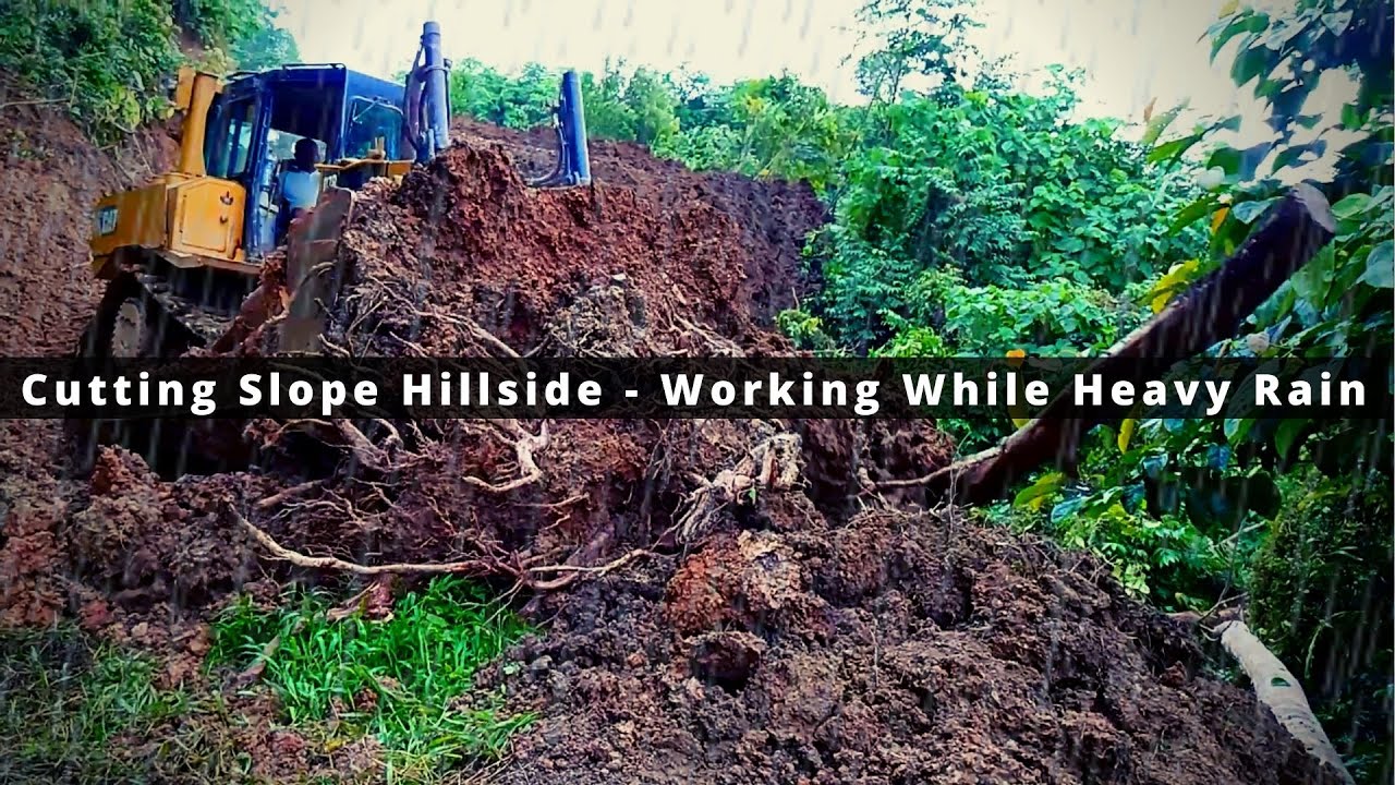 Cutting Slope With a Dozer - Open Forest Road While Heavy Rain