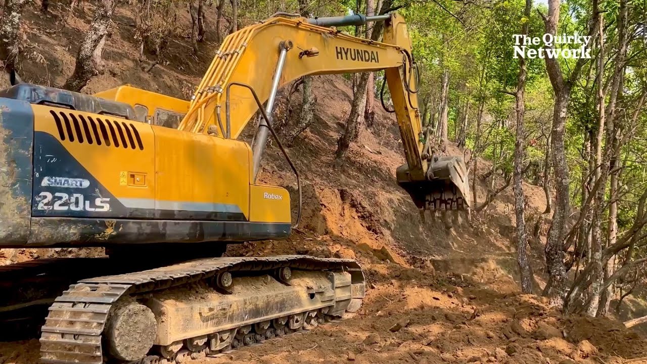 Excavator Constructing a New Road in the Bush