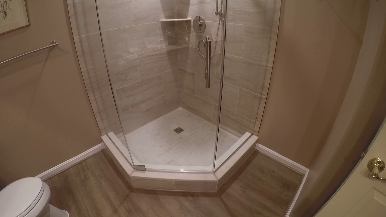 GORGEOUS Neo-angle custom shower with frameless glass enclosure.