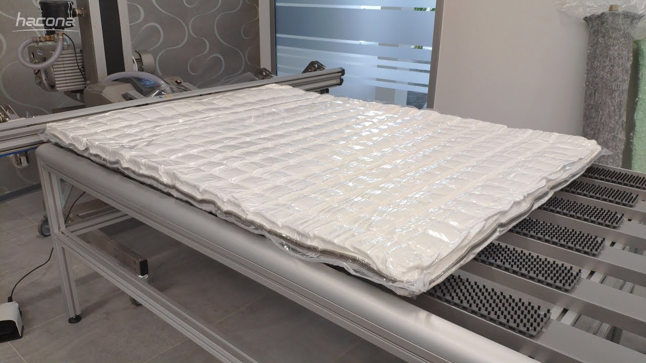 Mattress vacuum packaging & manual fold/roll up - Hacona VI-type industrial vacuum packagingmachine