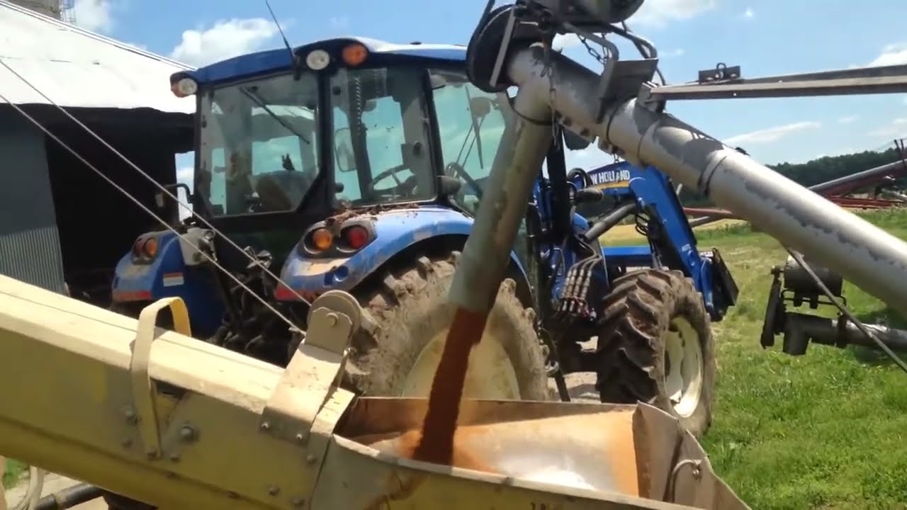 Usage of New Holland 355 Grinder Mixer on Farm