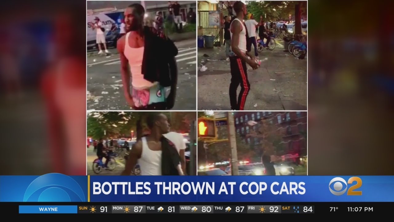 NYPD Releases Images Of Suspects Wanted For Throwing Bottles At Officers
