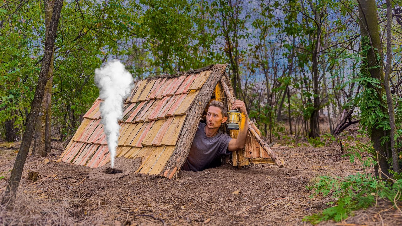 Building a cozy survival shelter. Warm stove, wooden shingles.Bushcraft,Survival Skills.