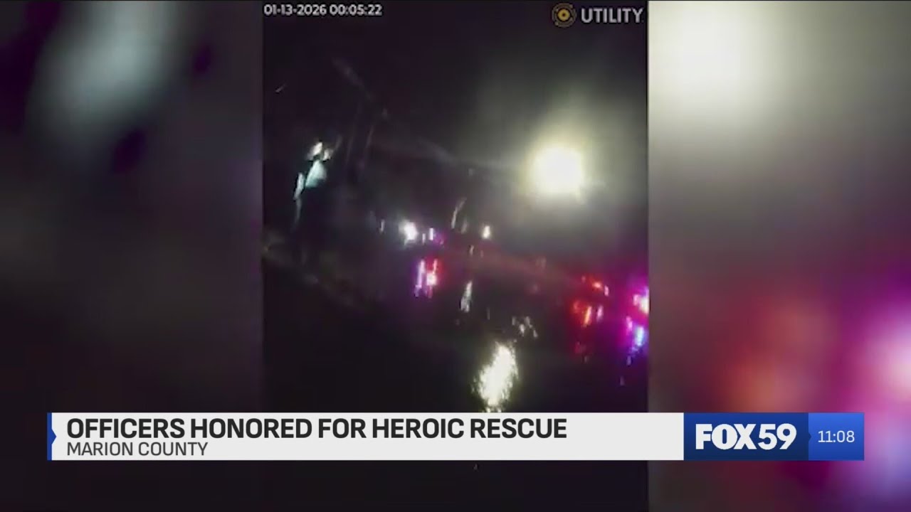 Indy police officers honored for pulling children from icy retention pond