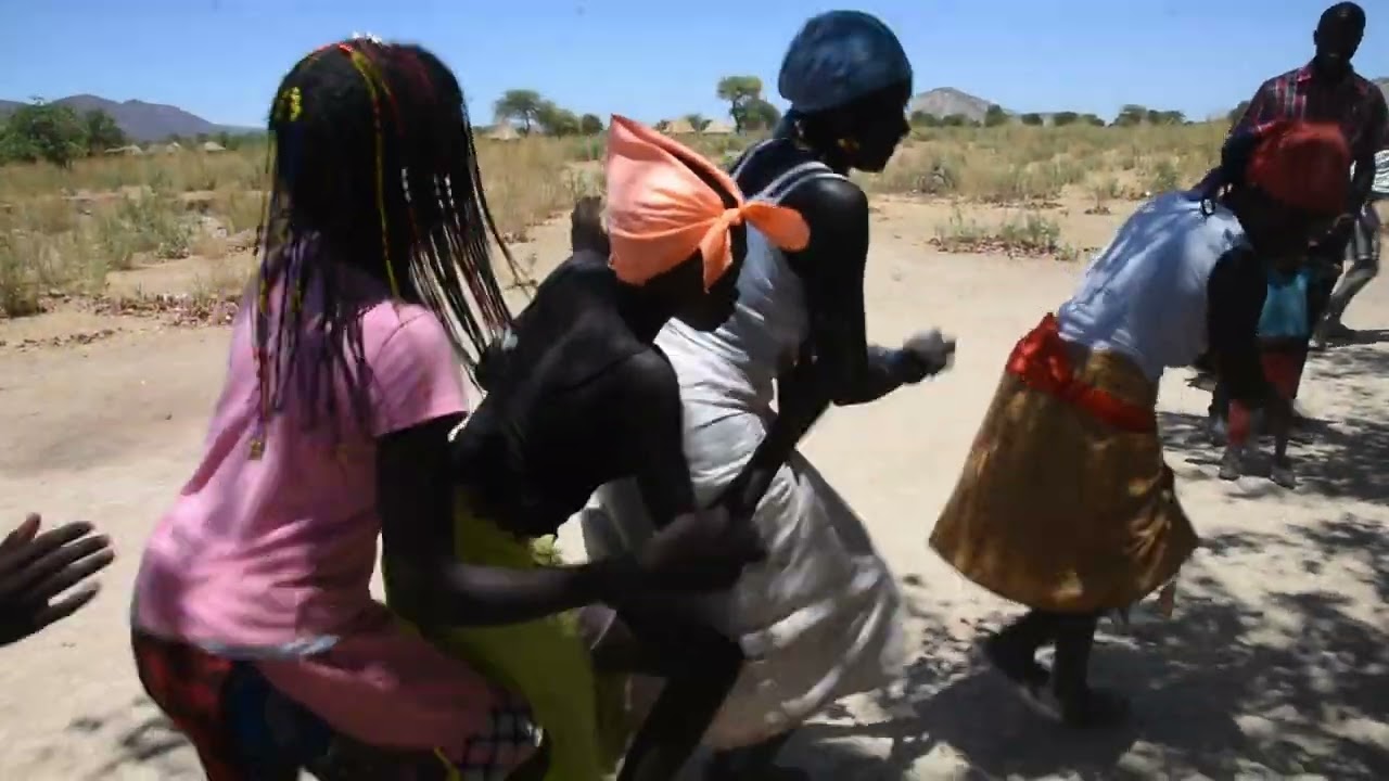 Zemba people signing and dancing