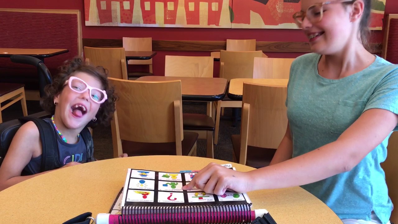 Big sister Modeling PODD while out to eat!