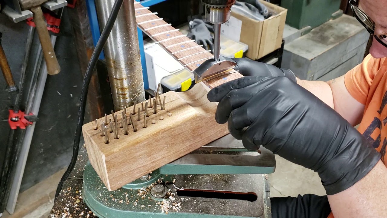 Pressing in the freshly cut fret wire