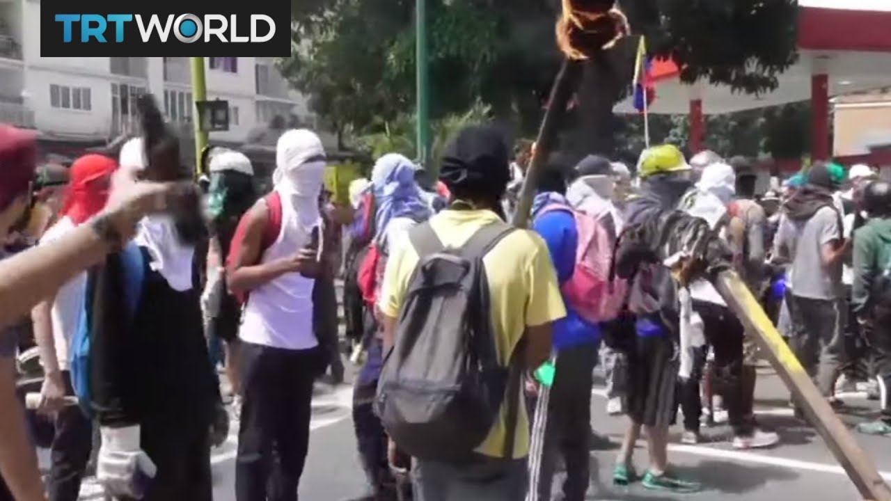 Security forces clash with opposition protesters in Venezuela