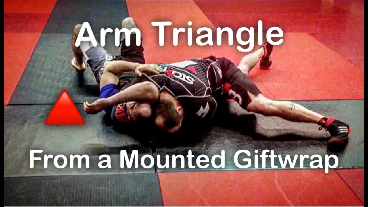 Mounted Giftwrap to an Arm Triangle Submission