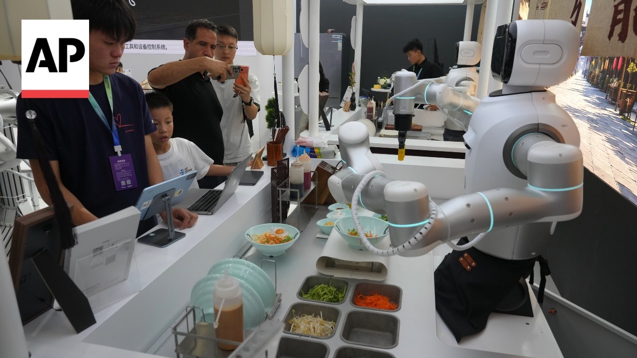 Humanoid robots perform tasks at the World Robot Conference in China