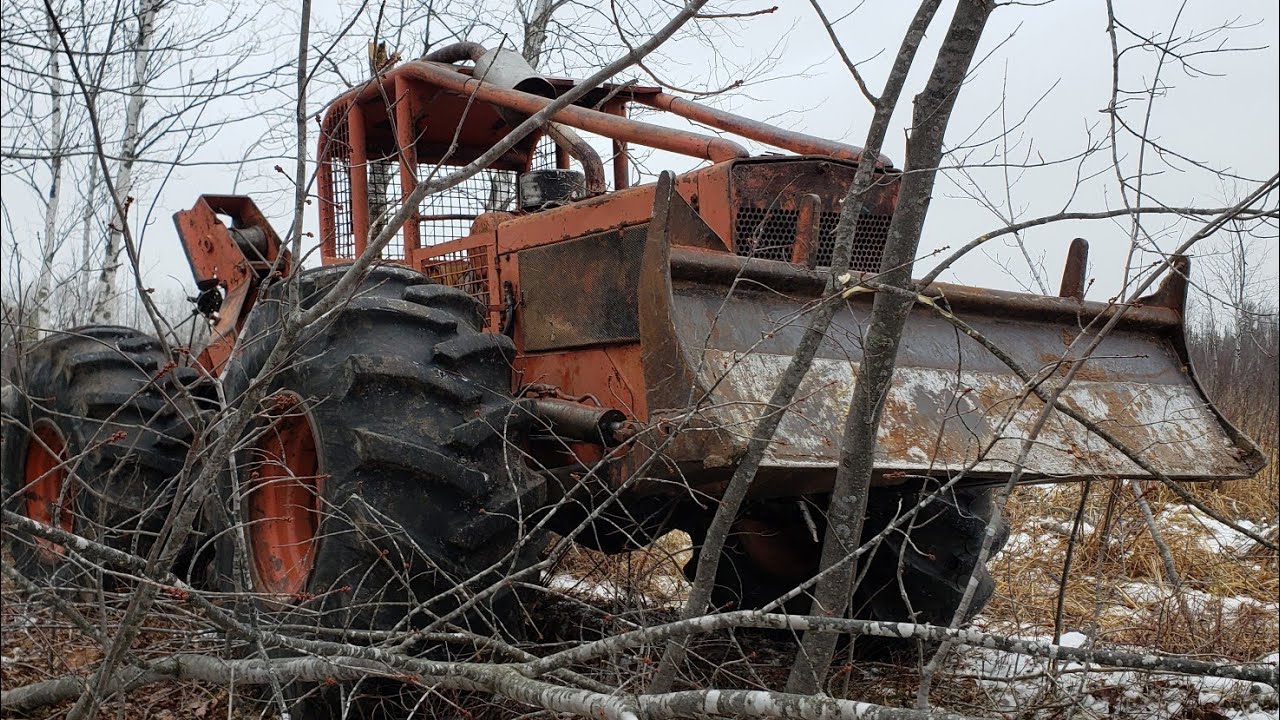 Logging with the Timberjack 230 Setting Chokers and Pulling Skids