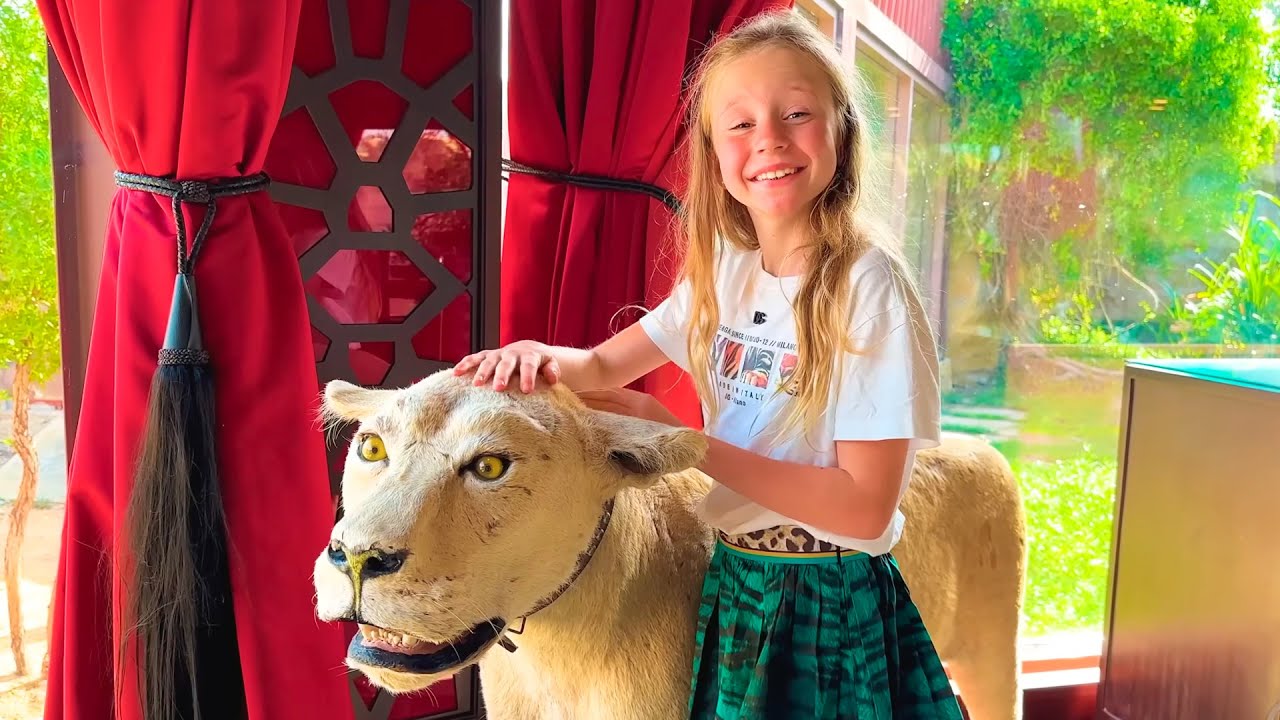 Nastya y papá en un viaje familiar a Dubai, exploran el parque de diversiones