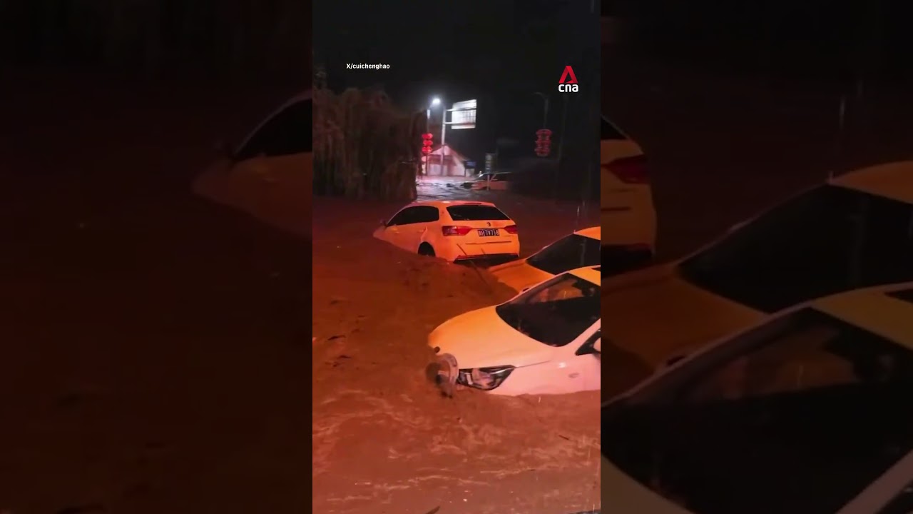Floodwaters from Typhoon Bavi sweep vehicles away in China