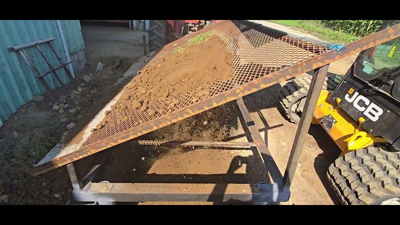 Farmer DIY top soil screener.