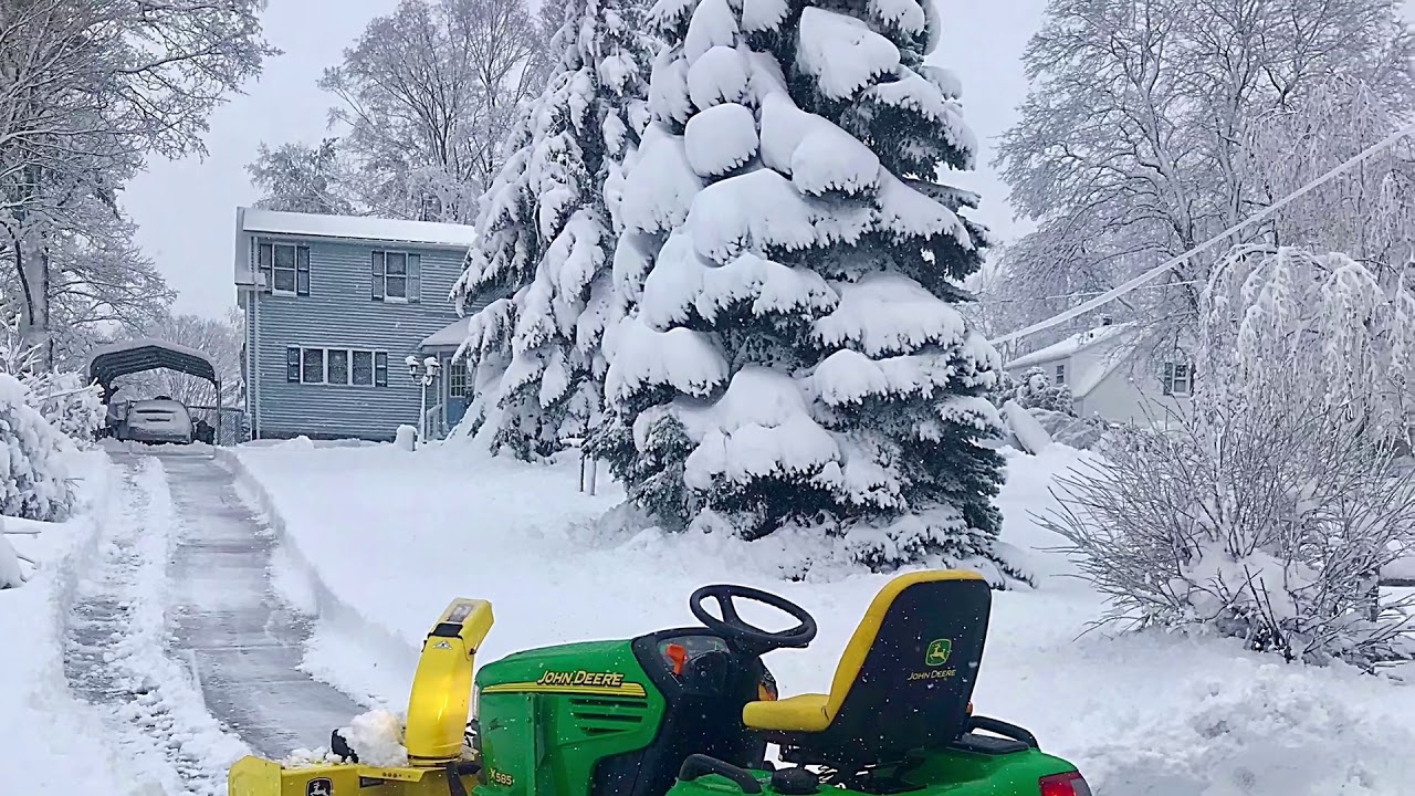 John Deere X585 with Snow Blower attachment