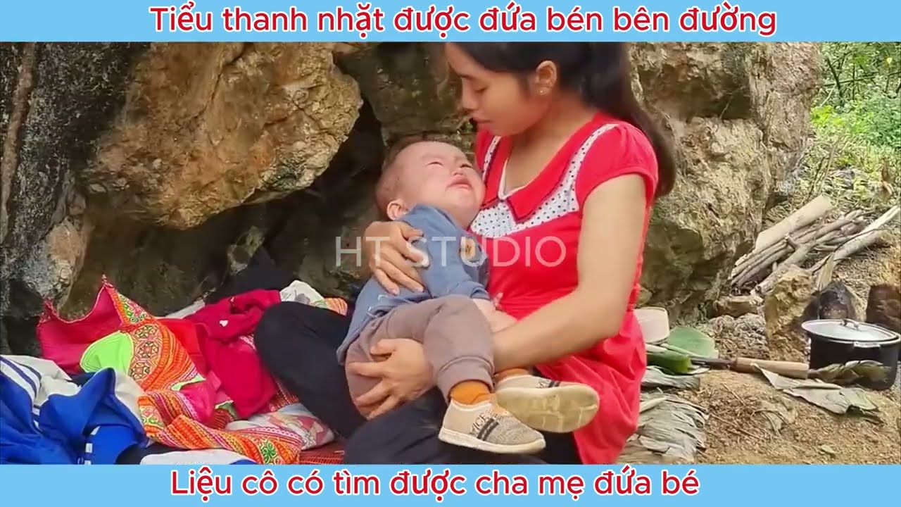 The girl picked up the child on the side of the road