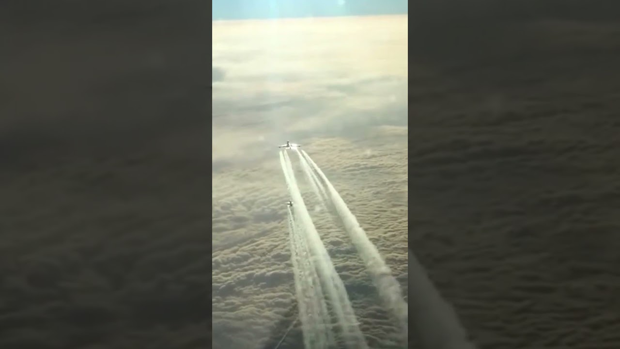 Airplane Flies above the Clouds