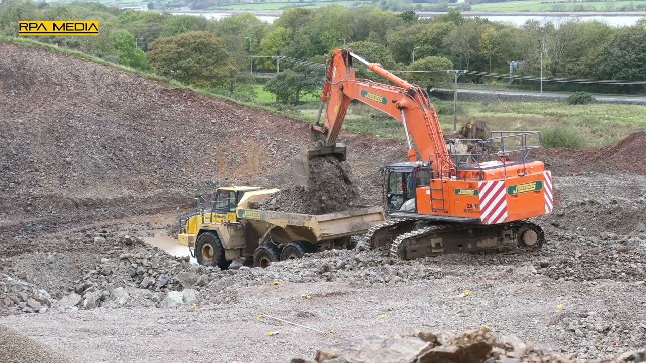 Hitachi Zaxis 670 loading stone on a bypass project