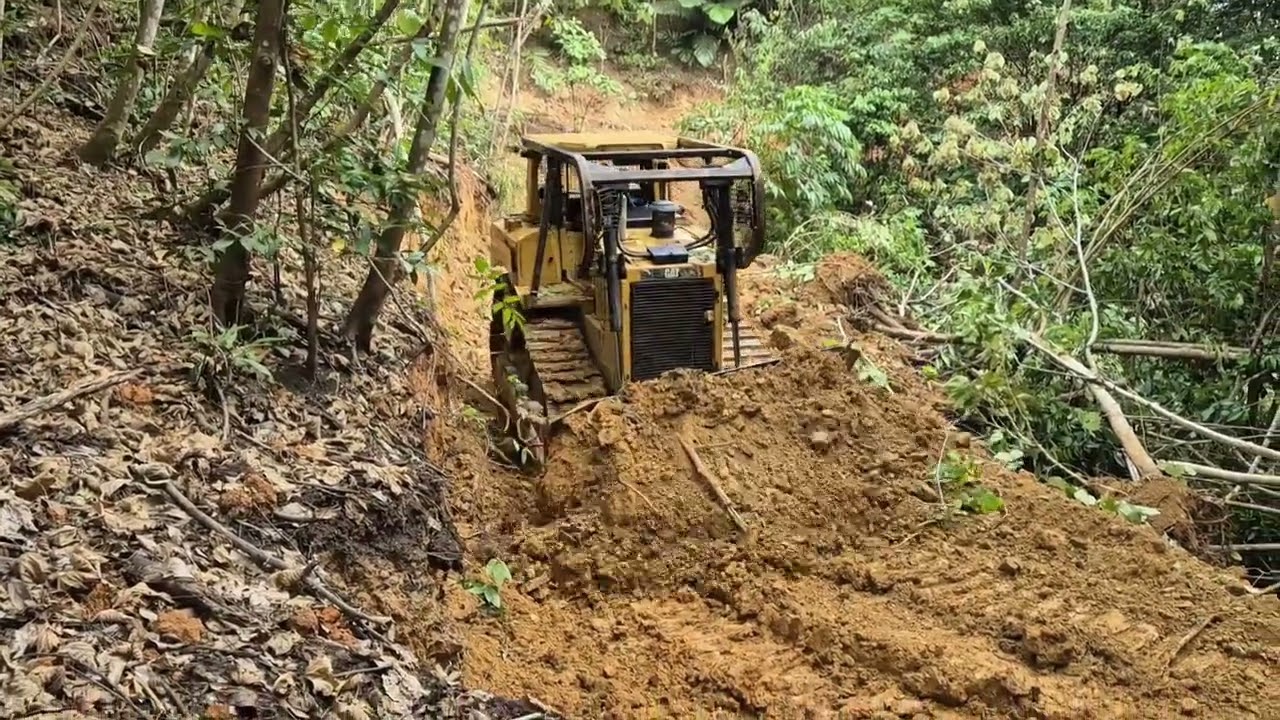 CAT D6R XL Bulldozer Cuts Through Rocky Terrain to Build a New Road