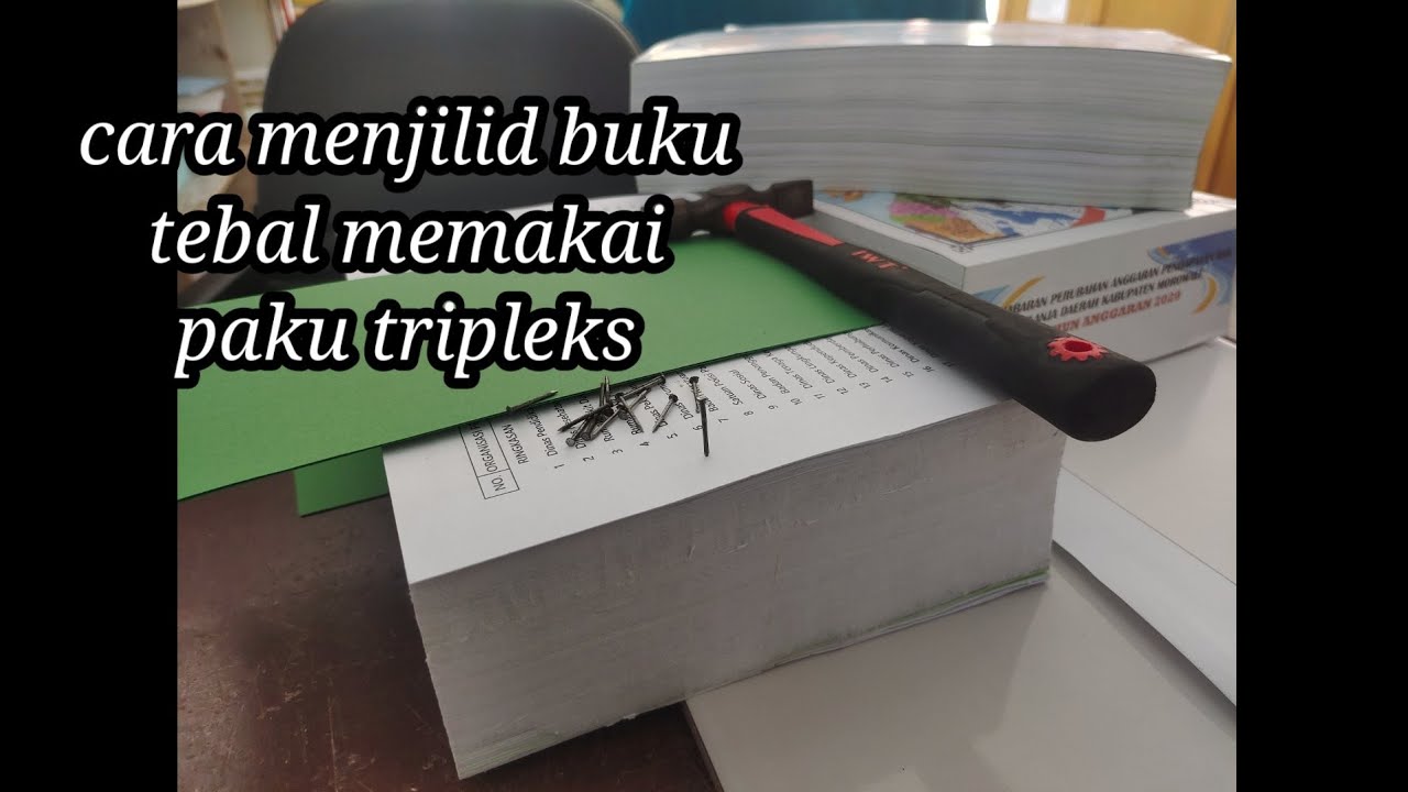 Cara menjilid buku tebal memakai paku tripleks