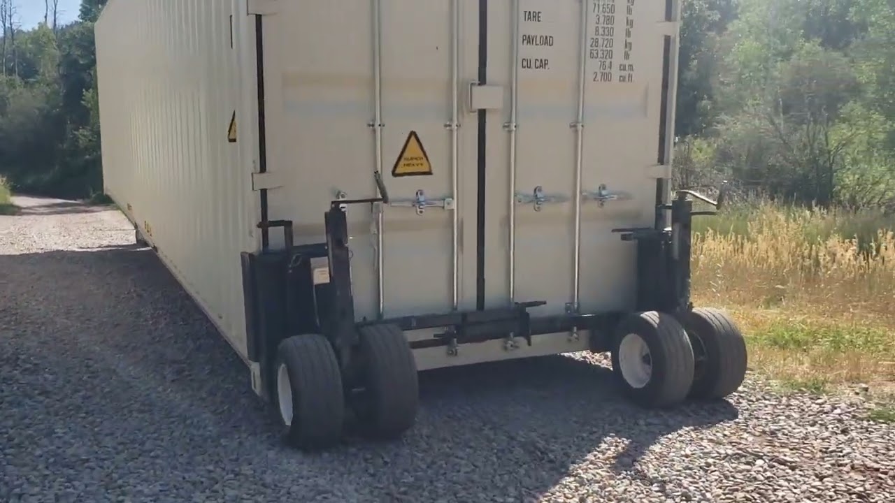 moving a shipping container with a mule.