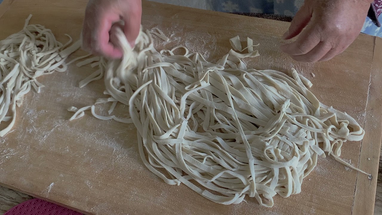 Making noodles at home with just flour and water.