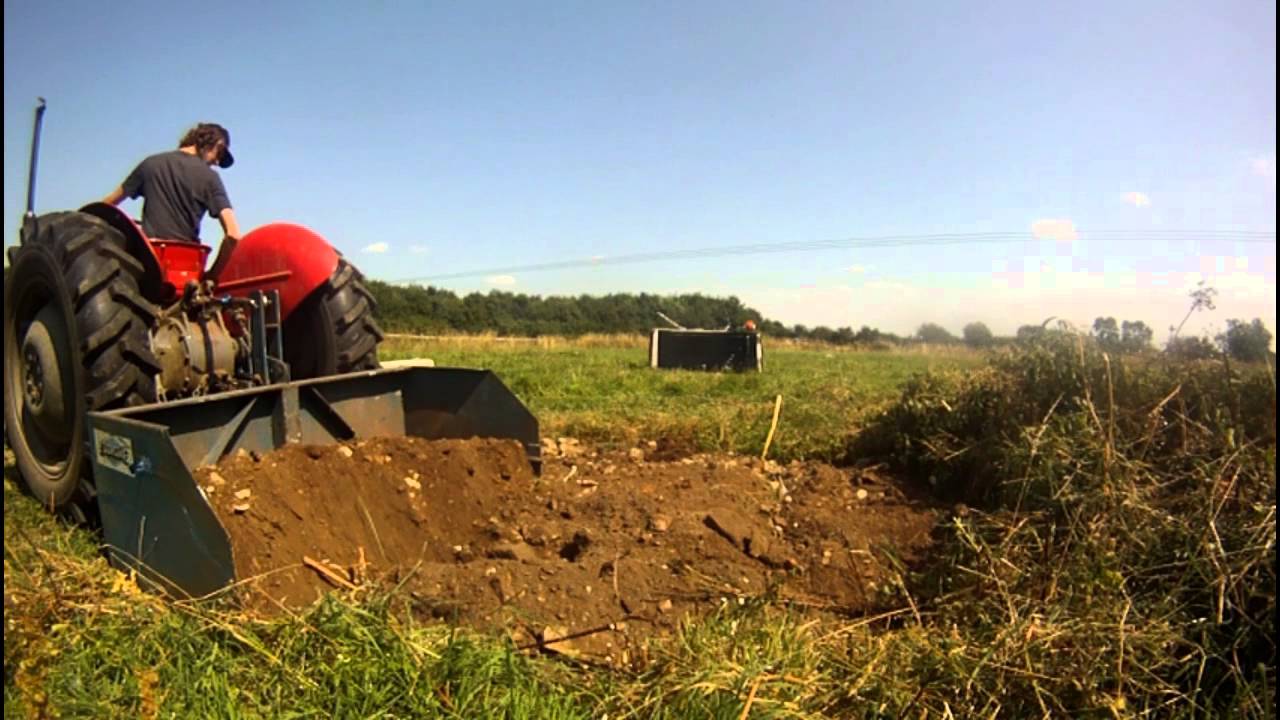 Filling in the old pond with the massey ferguson 35 and fleming transport box