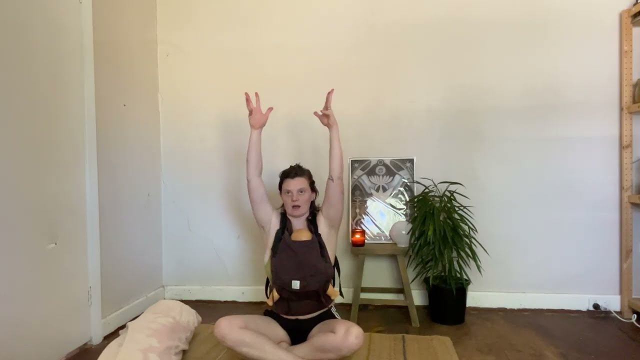 Baby wearing yoga class slow flow
