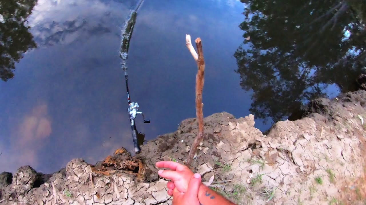 Funny fishing fail (fishing rod gets pulled in by a fish)