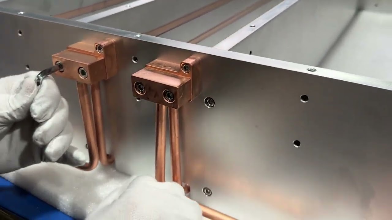 Copper tube liquid cold plates for cooling laser equipment