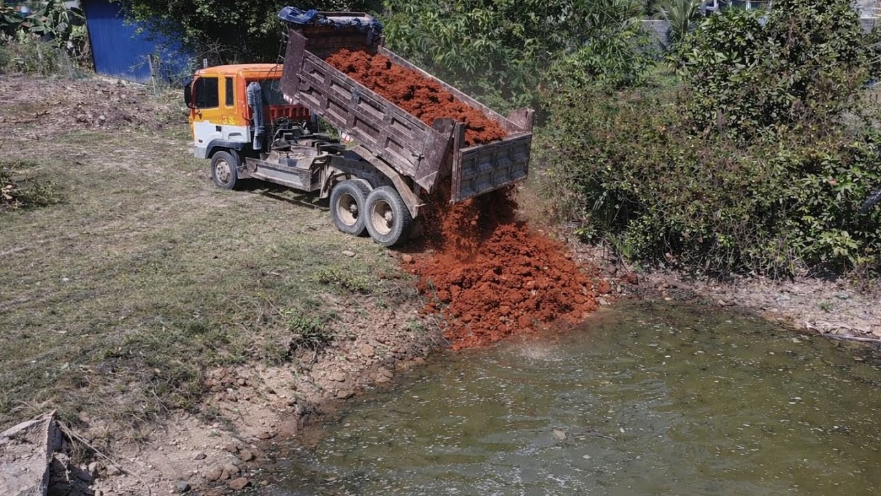 Start a great new project by filling the trench with a 5-ton earthmoving truck. & Dozer D20P 