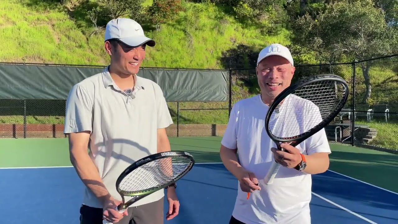 COACH JEROD TRIES THE RETENSER TO TIGHTEN UP HIS TENNIS STRINGS ON THE COURT