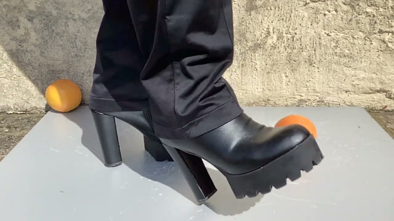 High lugged sole boots crushing grapefruit