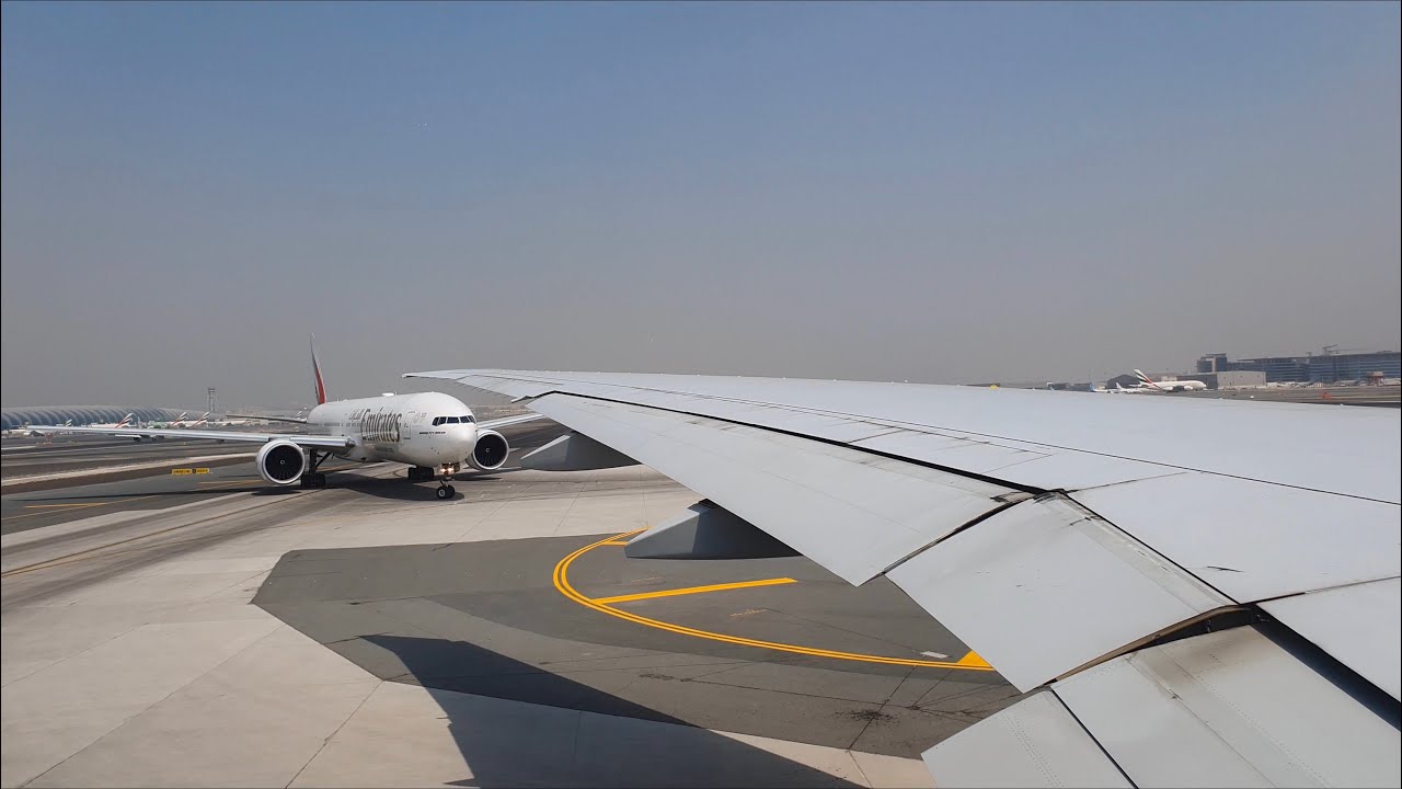 Emirates Boeing 777 Takeoff From Dubai and flying past Burj Khalifa