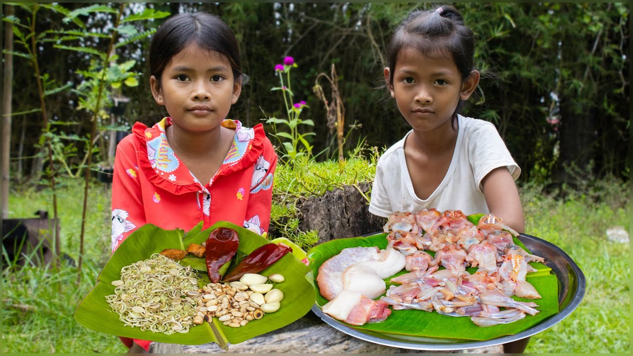 Delicious ! little chef fry Frog recipe , Tradition food , Rural life village under raining