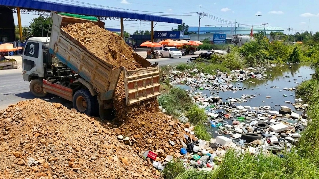 Heavy Equipment Power Filling and Leveling Ground for Development