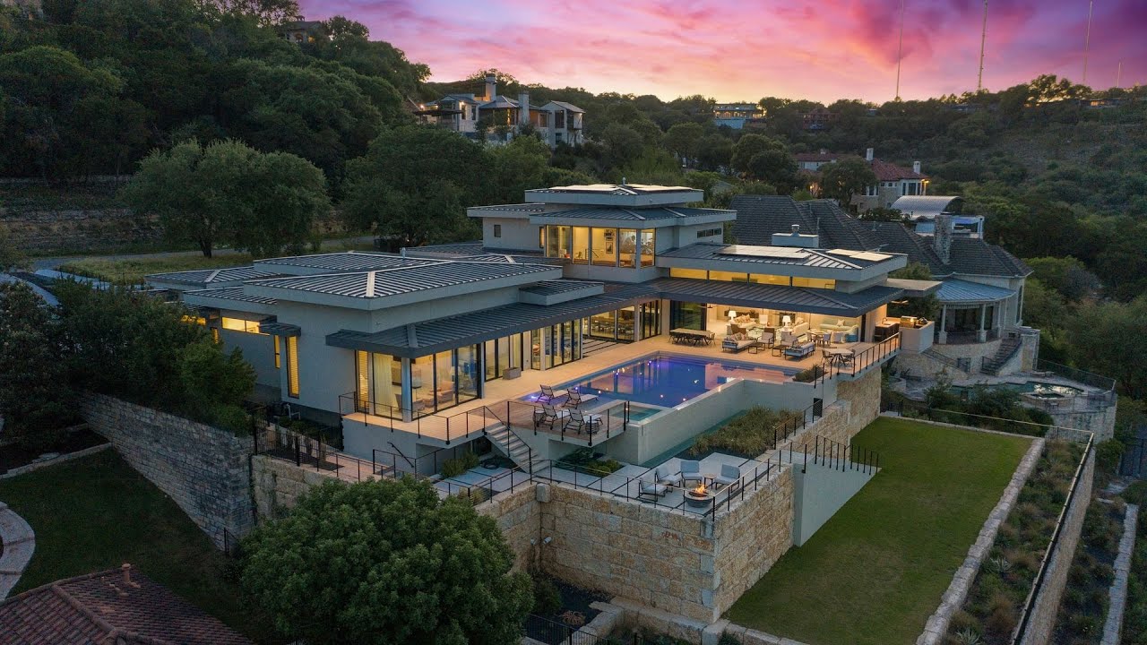 This $12,250,000 Exceptional contemporary home offers stunning views of Lake Austin and the City
