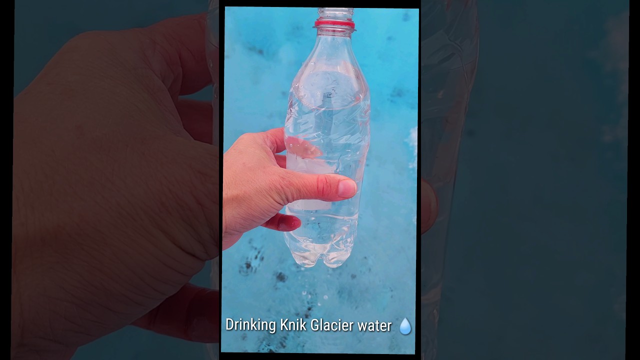 Getting crystal clear water from the Knik Glacier in Alaska 🏔